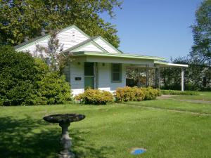 How about a well built charming 3 bedroom, 2 bath home with tons of character from original hardwood flooring to built-in shelving and an amazing courtyard for grilling out. It has plenty of cabinets, kitchen with hidden spice rack and a nice dining area. Double carport, spacious large lot with backyard completely fenced in. Home was occupied for 11 years by one owner and as of December 2016 there is a new A/C unit ...this home is a must see.Can be shown at anytime.