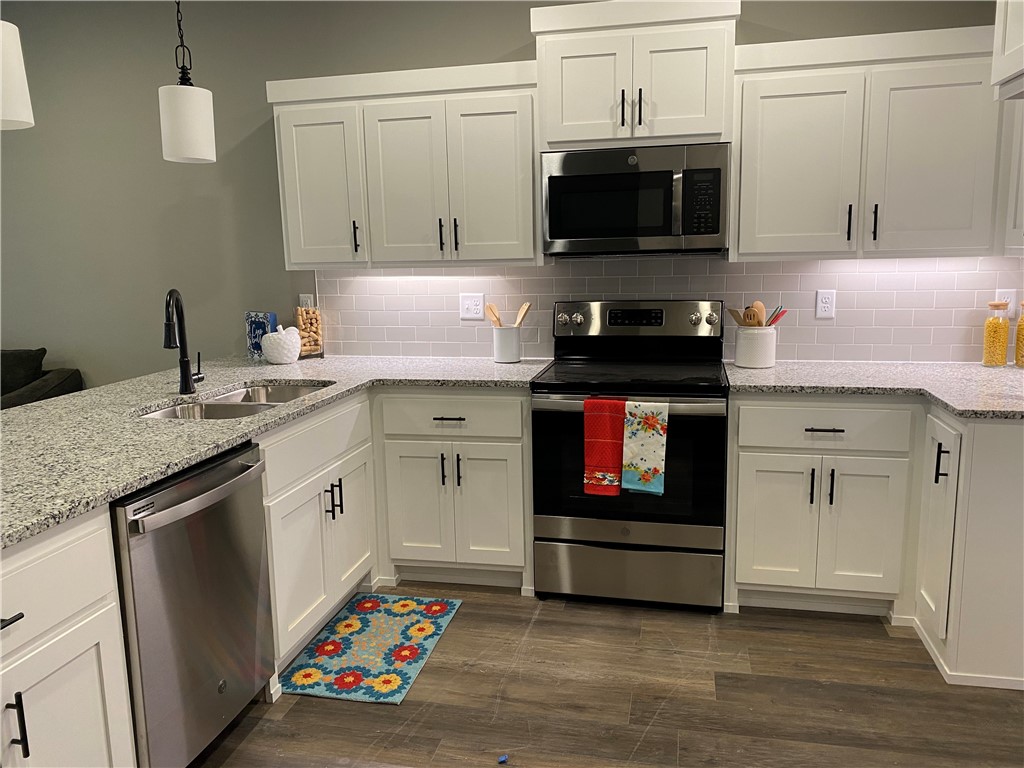 Gorgeous new construction townhome! This town home is just minutes from the interstate and the University of Arkansas. This home has a gorgeous view from the upper balcony, granite counter tops, large closets, and a custom interior design! Refrigerator, Washer, and Dryer included