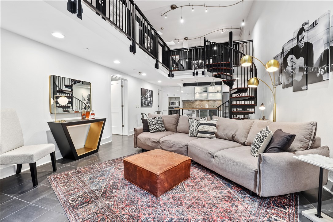 Modern condo in the heart of Fayetteville with an excellent location in the Historic Ice House Building. This condo has been recently renovated and the perfect place for strolling to Georgeās Majestic, Walton Arts Center, and the U of A. The location cannot be beat with the downtown arts district, town square, Dickson Street shopping, restaurants, bars and boutiques directly out of the back door.
The functional and user-friendly floor plan consists of two bedrooms on separate floors, each having its own full ensuite bathroom. A separate half bath is located on the bottom level off-of the kitchen. Enjoy the open concept with an island, gas stove and aesthetic spiral staircase.
This well managed property is close to the trail system. It's so easy to bike to work and school. Property comes with one free parking space and is steps away from the convenience of a new parking deck seconds from Dickson. This real estate opportunity is a highly successful short term rental with a current STR License w/ City.