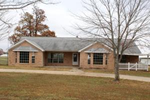 You'll love the view from this custom built 3BR, 21/2 bath home on 2.75 acres boasting beautiful oak cabinets, brick fireplace with wood burning insert...not to mention the 40'x 60' shop with concrete floor, 10'x 60' lean to, 16' x 13' door & 10'x 40' insulated workshop. All #'s are approx., age & sq. footage per assessor, buyer to verify existence of well & septic. Bank owned property selling As-Is.
