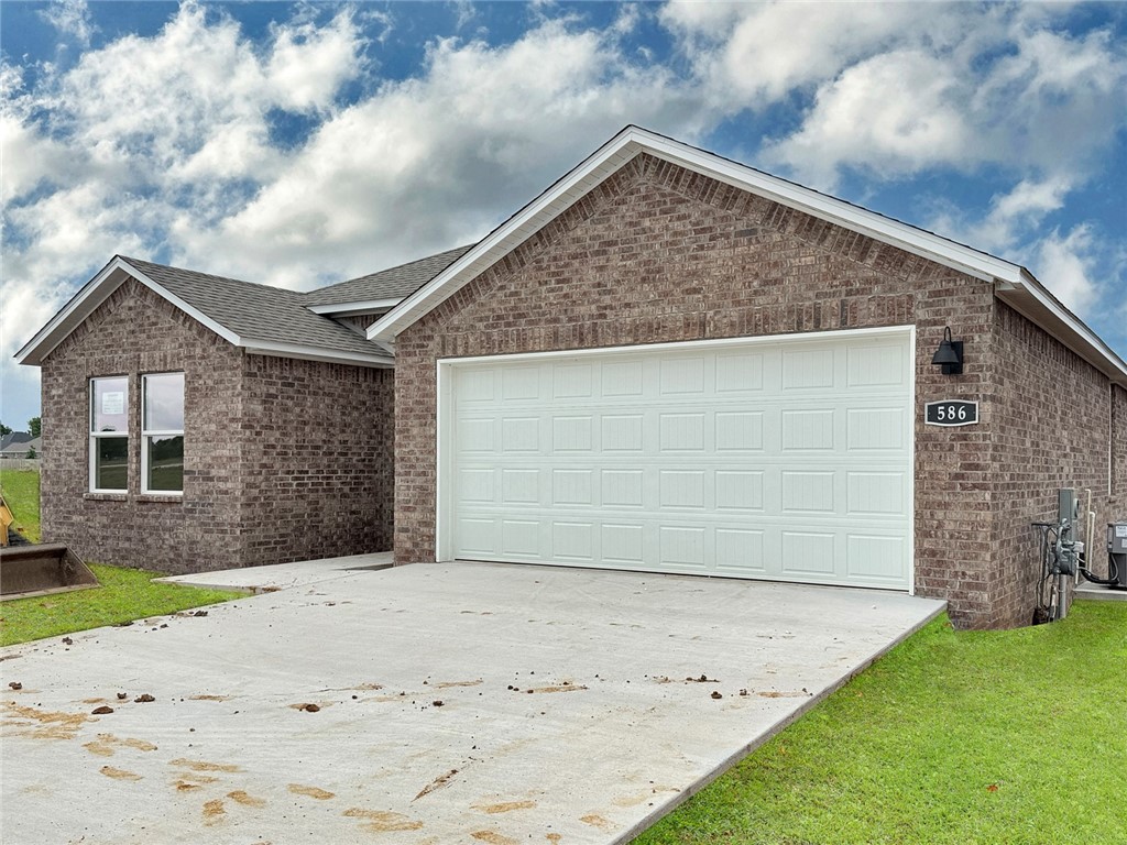 Sold before print! Lovely Huntsville Plan in Wagon Wheel Phase 2, in Farmington, Arkansas! Each home in Wagon Wheel is meticulously crafted with attention to detail, creating a space that feels both luxurious and welcoming. From the moment you walk through the door, you'll be greeted by modern features and spacious a layout that caters to every lifestyle. Our homes boast premium finishes and thoughtful designs, ensuring that you'll be stepping inside your own personal oasis. These homes will be complete with LVP flooring throughout and wood shelving in all closets, pantry and utility room. The kitchen will have quartz kitchen counters, 36-inch cabinets, and stainless-steel appliances! Home will have a Garage Door Opener. Primary bath will have quartz countertops, double sinks, and an oversized walk-in shower. Each home comes with 4-sided brick with Hardie ® per plan. Taxes and Parcel TBD.