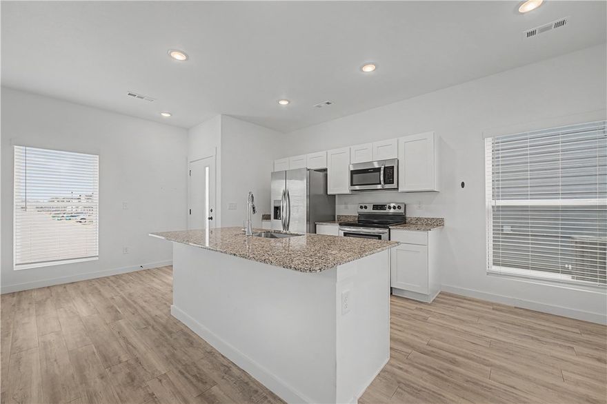 Modern, affordable living in Featherston Village! This 2BR, 2.5BA home offers low-maintenance living with no lawn care required. Located in the Bentonville School District and less than 5 miles from Walmart’s corporate headquarters—perfect for first-time buyers, downsizers, or investors.