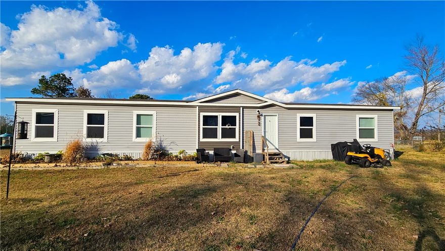 Discover modern comfort and thoughtful design in this stunning 4-bedroom, 2-bath Clayton home, offering 2,100 sq ft of meticulously crafted living space. Only a year old, this home truly did not miss a single detail. Step inside to an inviting open floor plan highlighted by a spacious kitchen with a large walk-in pantry, perfect for storage and entertaining. The living and dining areas flow seamlessly, creating a bright, welcoming space for everyday living. The primary suite is a true retreat, featuring very large his-and-her closets and a luxurious en-suite bathroom. Enjoy the expansive walk-in dual-control shower with two shower heads, designed for comfort and convenience. Outside, relax and unwind while taking in the wonderful backyard view. With its modern features, spacious layout, and attention to detail, this home is ready to impress—inside and out.