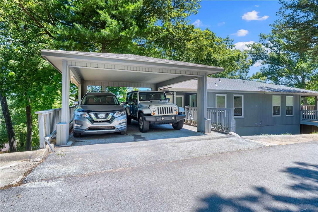 Upgraded and tidy, this stylish and affordable home overflows with opportunties; both recreationally and practically. Two bedrooms plus a spacious bonus room that could be used as a study or game room. Just 2 miles from the Bella Vista Country Club Golf Course & Clubhouse. Minutes to the Tanyard Creek Nature Trail & Waterfall, Lake Avalon and Lake Windsor. Easy access to Hwy 71. Bentonville schools! 20 minutes to Downtown Bentonville offers commuters a more affordable housing option whilst complementing an after-work/weekend outdoor lifestyle. Newer carpet & tile throughout; newer countertops; newer air conditioning unit; newer windows in downstairs bedrooms; roof replaced in 2021; deck replaced in 2023. Perfect home for 1st time home-buyer, investor, or empty nester. A designated 2 car carport makes this townhome stand out. Bedrooms and bonus room are on the lower level. Bella Vista Townhouse Assoc: $90/mo; POA dues: $40/mo (buyer or agt to verify). More info on Bella Vista POA: https://bellavistapoa.com/members/