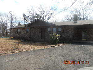 Semi-private all electric home sitting at the end of a dead end street. Private setting with detached workshop, garage, attached carport, kitchen, dining room, large living room with wood burning cast iron stove, bonus room for exercise, and office or a 4th bedroom. Home equipped with a security system and has city water and sewer. This is a relocation mngmt owned home. Seller will sell AS IS.