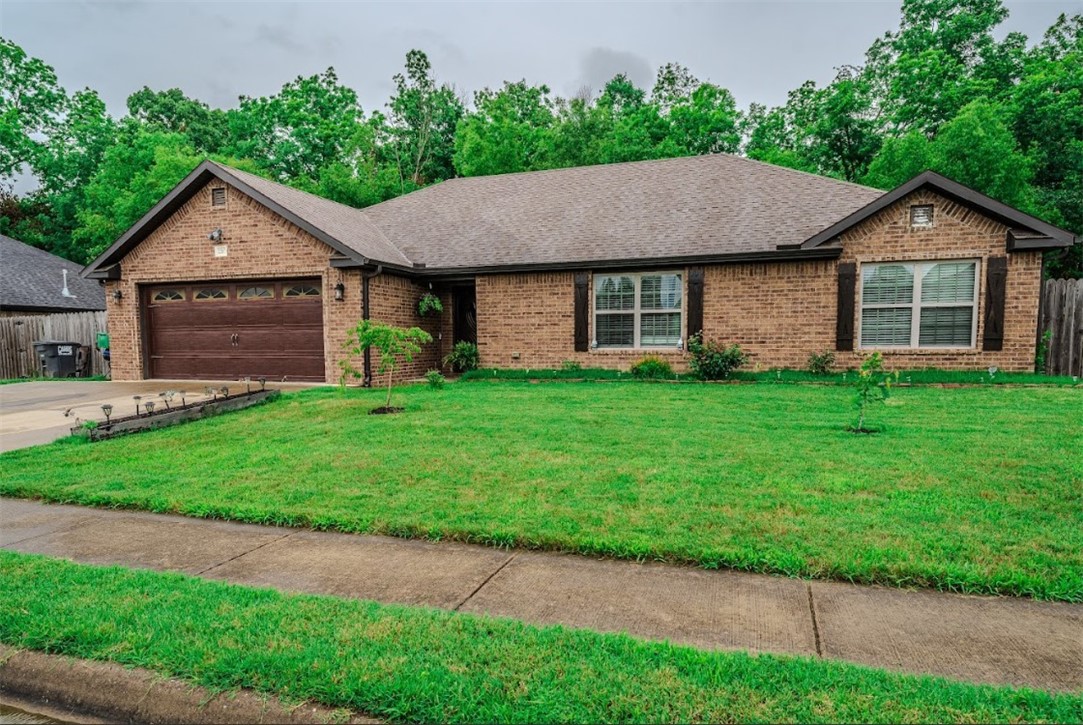 All-Brick 4-Bedroom Home with Ideal Location! This beautifully maintained 4-bedroom, 2-bathroom all-brick home, perfectly blending comfort, style, and convenience. The home features hardwood floors and a split floor plan that offers both privacy and functionality. A spacious living room ideal for entertaining or relaxing. The primary suite is tucked away for added privacy while three additional bedrooms provide plenty of space for family, guests, or a home office. Fully fenced backyard — perfect for pets, kids, or weekend gatherings. Located just 15 minutes from the University of Arkansas and only 10 minutes from Fayetteville's vibrant restaurants, shops, and entertainment, this home offers the best of both quiet suburban living and city convenience. Don’t miss your chance to make this ideally located, move-in ready home your own!