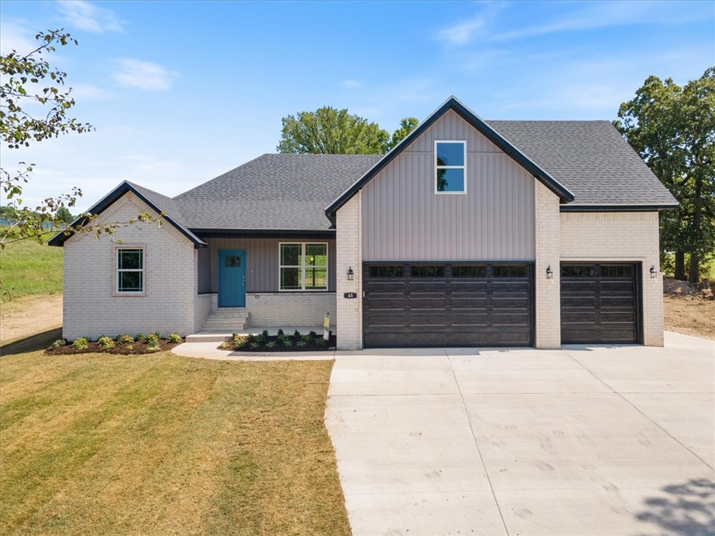 Welcome to this beautiful three bedroom, two and a half bathroom new construction home on the perfect lot boasting a breathtaking seasonal view of Table Rock Lake. Walk into the open concept house you've been looking for with modern white kitchen cabinets and black sleek granite countertops. The master bath has a walk in closet, a beautiful custom tile shower, and a jetted jacuzzi tub. You'll enjoy all the space this one offers with a large bonus room and half bath upstairs. Save on utility bills with the dual fuel heat system, offering an efficient way to heat and cool this home. Walk out to the covered patio with a built in grill and griddle combo. Enjoy the peaceful views of table rock lake, relax out on the patio, cozy up in the winter by the fireplace, or take the short drive to Eureka for shopping, dining, and entertainment. This home is located just minutes from the holiday island amenities such as the golf course, tennis courts, clubhouse and Holiday Island Marina. Listing agent related to seller.