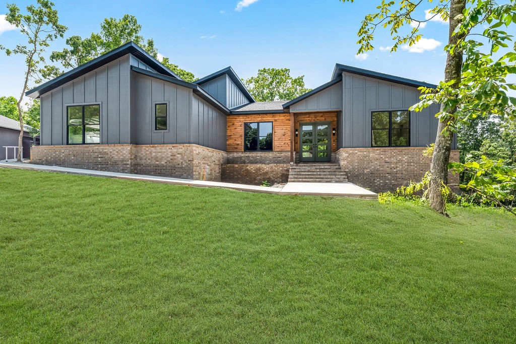 Come enjoy all the luxuries of a custom built home without any of the decisions. Beautifully built, 4 bedrooms, 3.5 baths plus an office, laundry room and mudroom. Fantastic location less than 400ft to hop on Sbat and the Back 40 Trail system, and not far from the Lake Ann Boat Ramp. Thoughtfully designed interior featuring an abundance of natural light and modern finishes that wow. This home was built for hosting. Open kitchen with expansive 10' quartz island. Oversized gas range and rangehood, plus a double oven insert means you can cook for everyone. Hidden walk-in pantry to to the right of the built-in commerical double fridge. Fourth bedroom with private bath and big closet makes for a great long term guestroom or mother-in-law suite. Large back deck with granite counters, grill station, and refrigerator. There's even room in the backyard to add a pool! (septic is on the right side of the house). This home is nearing completion by mid-late August and ready to be called HOME.