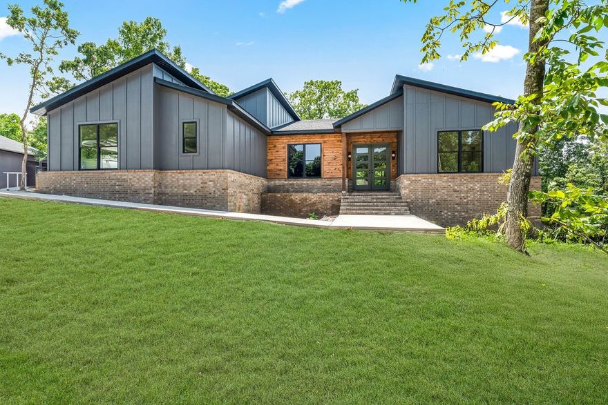 Come enjoy all the luxuries of a custom built home without any of the decisions. Beautifully built, 4 bedrooms, 3.5 baths plus an office, laundry room and mudroom. Two parcels make up .83ac in a fantastic location less than 400ft to hop on Sbat and the Back 40 Trail system, and not far from the Lake Ann Boat Ramp. Thoughtfully designed interior featuring an abundance of natural light and modern finishes that wow. This home was built for hosting. Open kitchen with expansive 10' quartz island. Oversized gas range and rangehood, plus a double oven insert means you can cook for everyone. Hidden walk-in pantry to to the right of the built-in commercial double fridge. Fourth bedroom with private bath and big closet makes for a great long term guestroom or mother-in-law suite. Large back deck with granite counters, grill station, and refrigerator. There's even room in the backyard to add a pool! (septic is on the right side of the house). This home is nearing completion by mid-late August and ready to be called HOME.