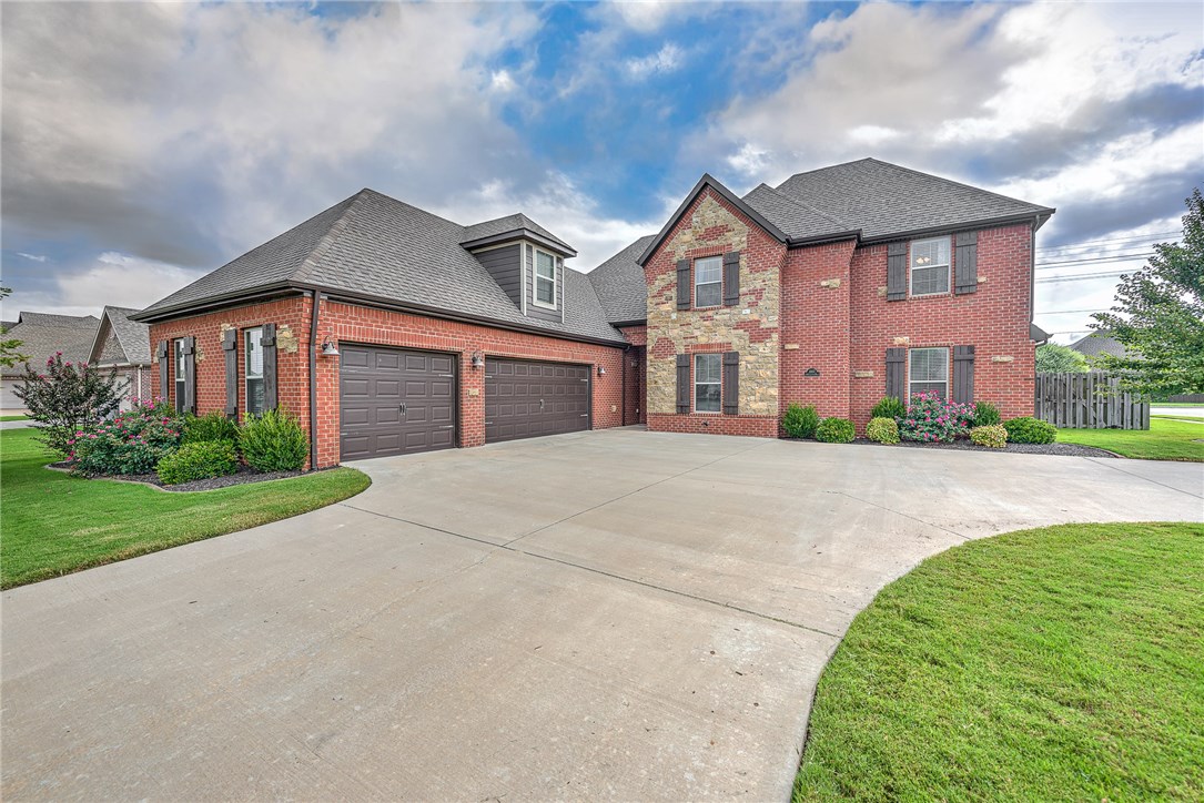 Wonderful 4 bed, 3 full bath, 2 half bath home in the Cornerstone Ridge Community! With over 3,200 square feet, this home is sure to wow you with all of the modern details inside. Find a Cozy, yet versatile living room when you first walk in; with beautiful hardwood floors, a granite faced fireplace and built-in entertainment center. Create delicious meals in the kitchen, complete with granite countertops, large island, stainless steel appliances, white cabinetry with backsplash and custom hood vent. An open floor plan between the kitchen and dining room creates the perfect environment to entertain guests. The master bathroom is equipped with a jacuzzi, walk in shower, walk in closet and a Jack and Jill style sink complete with vanity. Enjoy time outdoors on the covered patio or stay warm by the built in fire pit! Located minutes from all of the attractions of downtown Bentonville!