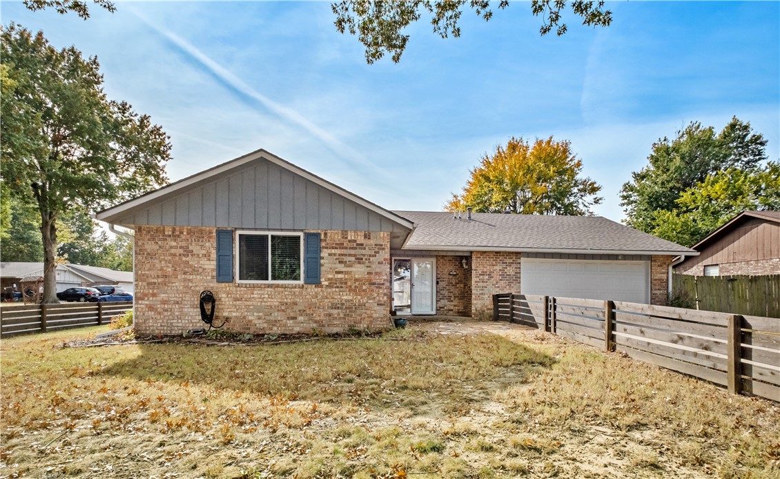 Wonderful Springdale home that's just a quick walk to T.G. Smith Elementary and moments away from J.B. Hunt Park, Nature Center & Razorback Greenway! This 3 bed/2 bath traditional home on a fantastic corner lot features a welcoming floor plan with a bright entrance. Spend time in the living room enjoying the wood-burning fireplace (with custom-built wood mantel!), or hang out in the eat-in kitchen w/ refreshed cabinets and all stainless steel appliances (including wine fridge)! Upgraded flooring and paint can be found throughout much of the house. Relax on the front porch as you admire the new, attractive horizontal wood fence (which compliments the property SO well!), OR spend time on the back patio admiring the garden areas as you sit in front of the grand outdoor fireplace! Need a climate-controlled place to work outside? The storage building/shed has both cooling & heating! Less than 1 mile to Walmart, great restaurants, Fire Station & Hospital and only 1.5 Miles to Lake Springdale. New Roof (2018). Sold As-Is.