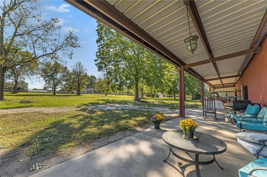 Wowza...Talk about a unicorn property!!! 8.5 acres just minutes from downtown Rogers and downtown Bentonville. The entire property is fenced with 6ft horse fencing. The building is a red iron structure with 3,500 sq/ft of open shop space and 1,500 sq/ft of living space. Mature pecan trees, walnut trees and grape vines highlight the property. Make this your primary residence or build your dream home next to the shop, the possibilities are endless.