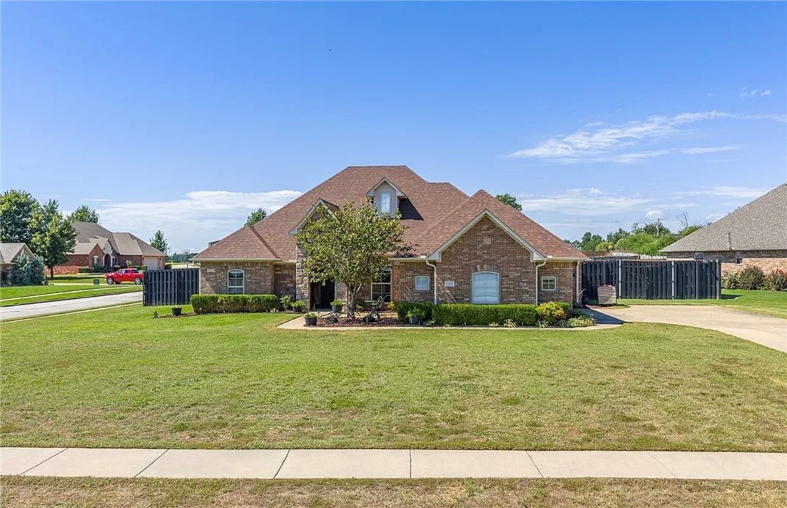 Set in the beautiful Blackstone Ranch community in Fort Smith but within the award-winning Greenwood School District, this beautiful home blends modern upgrades with everyday comfort. Wood floors extend through most of the home, while granite countertops elevate the kitchen, all 3 bathrooms, including the laundry room. Fresh paint, updated lighting, ceiling fans, & exterior sconces create a polished, move-in ready feel. The kitchen is designed for both function & entertaining with a gas stove, double ovens, & newer appliances including a microwave & dishwasher. Additional highlights include a 3-car garage with insulated doors and built-in wooden shelving, high-efficiency HVAC, a wired sound system, & a security system. Outdoors, enjoy just over half an acre with an oversized patio, raised garden beds, hammock posts, an astro-turf play area ready for your playground equipment, and a fire pit—all enclosed by an 8-foot privacy fence ready to enjoy! Come love where you live at this Blackstone Ranch retreat!