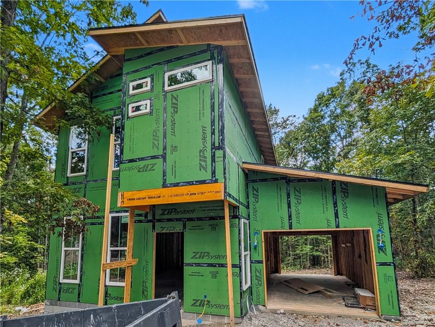 Welcome To Your Next Home At 4 Hart Lane—Where Cool Meets Convenient! This Fresh Modern Build Puts You Right Where You Want To Be, With Mountain Bike Trails Literally Around The Corner. Step Inside And Feel The Vibe: Soaring 9-Foot Ceilings, A Sleek Open Living Space, And A Fireplace That Brings Just The Right Amount Of Cozy. The Kitchen Brags With Custom Cabinets, Polished 3CM Granite, And Bar Seating That Begs For Friends, Food, And Fun. The Eat-in Dining And Half Bath Round Out The Main Level. Upstairs, The Primary Suite Is A Winner With Dual Vanities And A Walk-In Tile Shower In The Primary Bath. Two More Bedrooms, Another Full Bath, And Laundry Keep Life Easy. Outside, Kick Back On The Patio Or Gear Up For Adventure—This Home Is Modern, Functional, And Ready For All The Things. Still Time To Make Selections! (see this home further along at 6 Romine Pl, Bella Vista) **Deeded as 2 bed septic. 3rd room to be considered office/bonus or other non sleeping room.