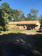Affordable home on the edge of town! Own for less than rent in this charming brick home with a lot of potential. 3 bedrooms, open kitchen and dining, and a carport for covered parking are just a few of the features this home has to offer.