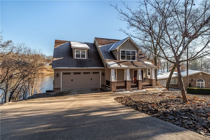 This Craftsman style home of 3388 sq.ft has true craftsmanship quality throughout with lake front views from several rooms.4 bed,4.5 baths, 2 living areas, workshop/exercise room, custom landscaping, fire pit and boat dock. Oversized 2 car & 1 car below, wood floors, wood beams, New appliances, Family/theater-room, 3 HVAC systems, computer room, tons of storage this is a must see!! All Applications are online at MetroRentsNWA.com