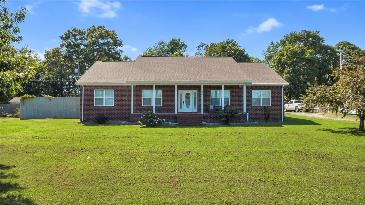 Beautifully updated home on a quiet street in West Fork!
This well-maintained property features a spacious living room with vaulted ceilings, propane fireplace, and new vinyl plank flooring. The kitchen offers updated granite countertops, freshly painted cabinetry (approx. 3 years ago), subway tile backsplash, and updated stainless appliances.
The split floor plan includes a private primary suite with tray ceiling, wood accent wall, and French doors to a re-done back deck. All bedrooms have new carpet. Granite vanity in the guest bath. You'll also find a dedicated laundry room for convenience.
Enjoy the fenced backyard with an approx. 8’x10’ shed that conveys. Fireplace is propane; all other utilities are electric. Just minutes from I-49, schools, and parks. Shed outside the fence does not convey.