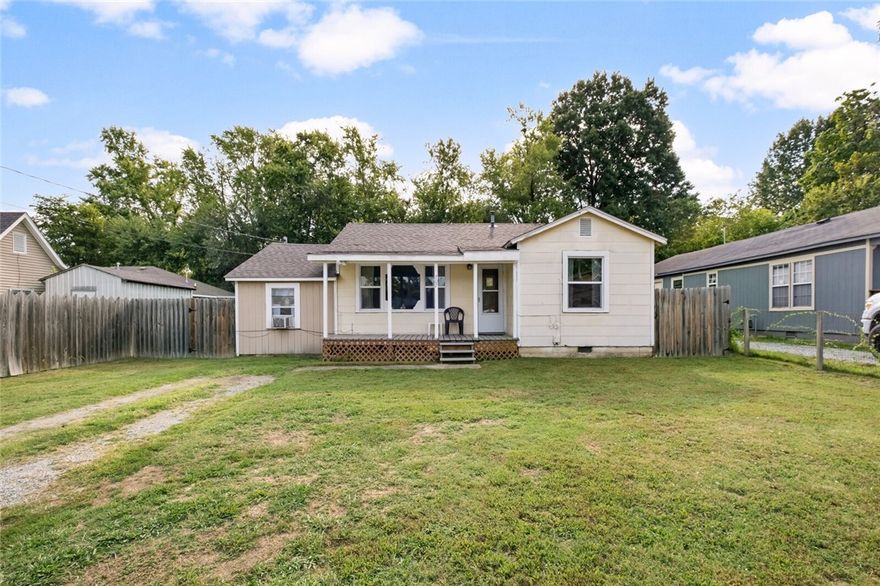 This charming 3-bedroom, 1 bathroom home is freshly painted and features an East-facing kitchen with a view of the big backyard. Enjoy a cup of coffee every morning, watching the sunrise, and unwind in the evenings with a glass of sweet tea on the front porch as you take in a beautiful sunset. The home is located within walking distance of the Siloam Springs Public Library, farmer's market, downtown Siloam Springs, walking/bike trails, baseball park, and many restaurants. All appliances to convey.