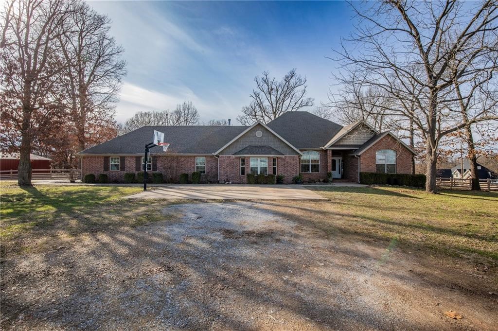 1.28 acre corner lot just west of Bentonville West HS In ground pool Garage/shop