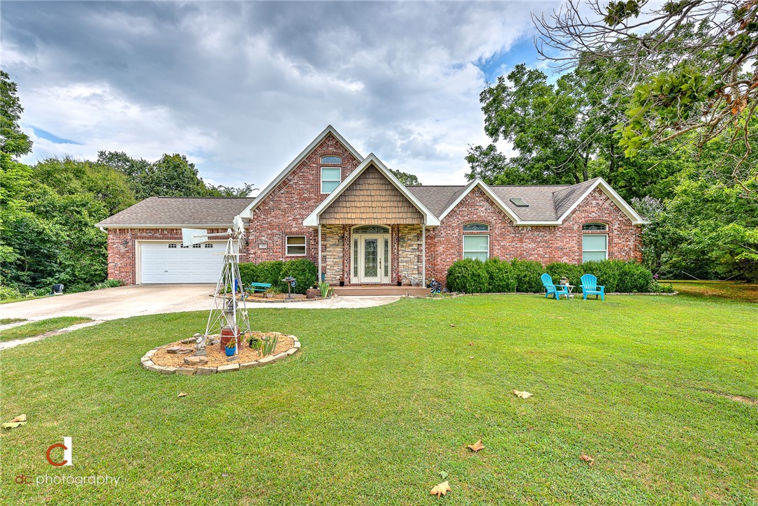 Location, location, location- 5 miles to I-49 and less than 10 mins to Lake Wedington. This home is beautifully surrounded by mature trees on a 1 acre lot, and boasts an open floor plan with an
A-frame wall of windows to allow natural light throughout the home. Chef's kitchen with custom white cabinets with some glass front for display, also includes a butcher block island. Family room with vaulted ceilings, fireplace flanked with built-ins. Great sized owners suite with a barrel vault ceiling with accent lighting. Owners bath with detailed custom tile work. Secondary bedrooms with oversized closet space. You will enjoy entertaining on the spacious back deck, and gathering the family around the bonfire area to enjoy the privacy that awaits you.
See attachment for items that do not convey. Also, HD antenna in the attic above the garage does not convey.