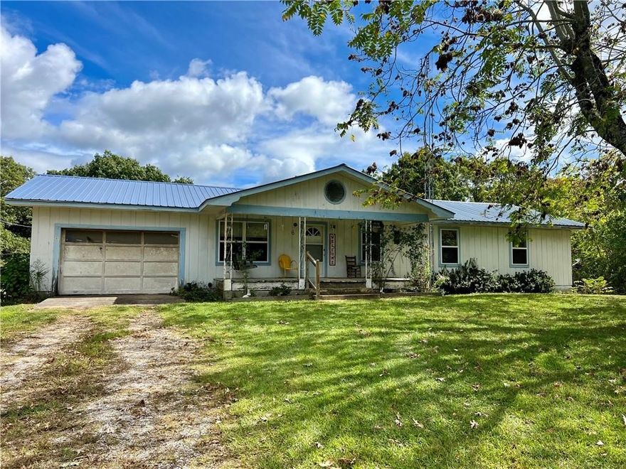 3 Bed, 2 Bath home on 4.33 acres in the Wayton community of Newton county Arkansas. Large front yard, attached garage, detached metal shop, pond, and RV pad, multiple heat sources, and central HVAC are great extras with this property. Home is clean and well maintained, move in ready and ready for some great updates. Easy access off of Hwy 327 but still in a rural peaceful area. Near lots of hiking trails and creeks.