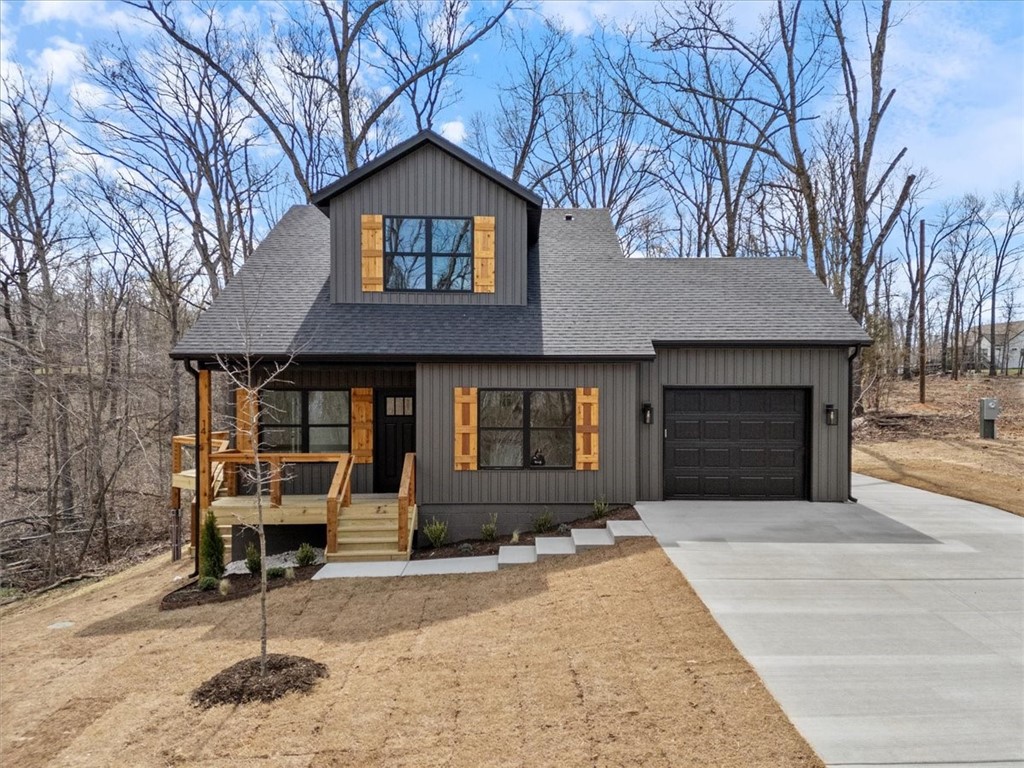 Exciting new two story plan on a picture-perfect lot, with quick access to the Bella Vista Bypass, making this location 15 minutes to Bentonville! Bring you golf clubs and your kayak! The Highlands Club house is 2.4 miles from your new home, and the Tyree access to Loch Lomond lake is less than 2 miles away! The curb appeal is charming and the interior finishes are top notch. Beautiful flooring, quartz counters in the kitchen and both baths and stunning light fixtures. The upstairs primary suite features a primary bath with double vanity, a fully tiled shower and LAUNDRY! Main level bedroom could also be a great offlice space. The virtual staging in the photos shows just how remarkable this home could be with your furnishings. The perfect deck for your barbeque grill overlooking your large lot bordered with mature trees. Don't wait to schedule to see this one! New construction at this price point is difficult to find!