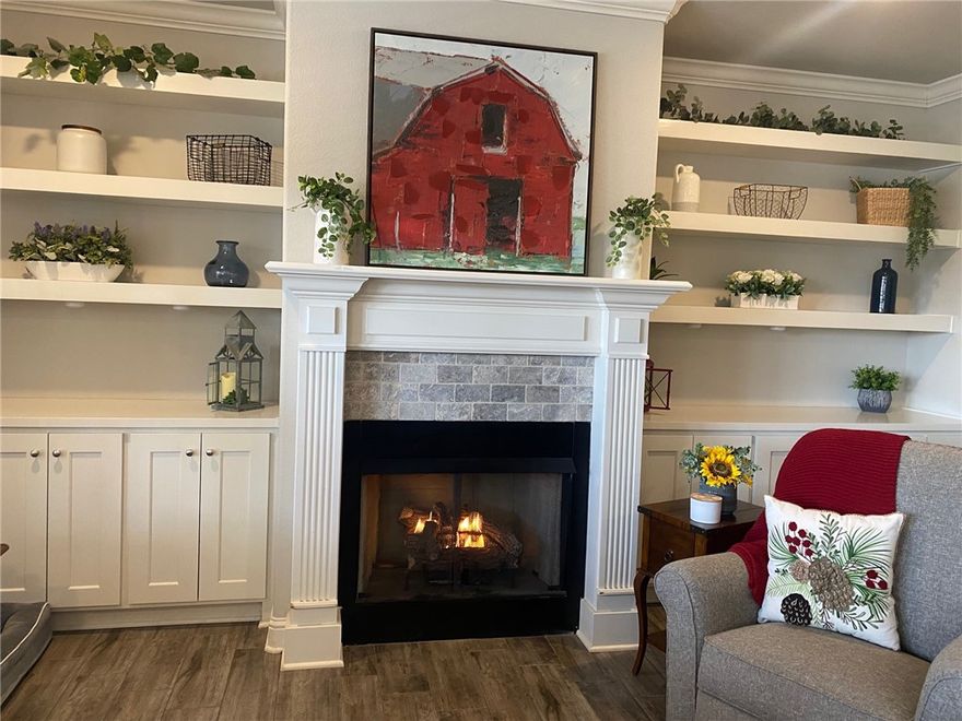 this 5 year old gem is conveniently located near 71 and Walmart - has 4 bedrooms, an open floor plan with 9' ceilings and crown moldings, a fenced yard with pergola and shed and is on public sewer -two bedrooms are carpeted and other rooms are ceramic - fireplace in living room flanked with bookcases - primary bedroom has two walk-ins and double vanities plus soaking tub - rear deck is covered - house is light and bright - lives easy and feels good - 12" block foundation filled with concrete -courthouse says 1831sf, builder said 1828, appraisal said 1899 sf