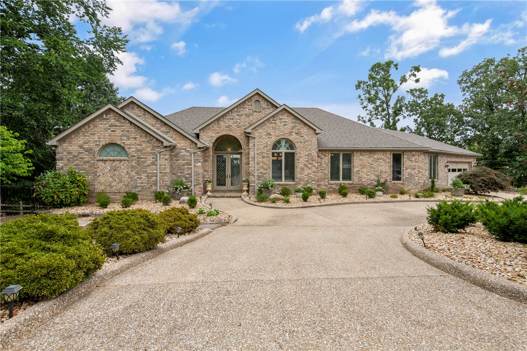 WOW! This spectacular 4 bedroom, 3.5 bath home has recently been updated and refreshed. Move in ready! Plus, you'll enjoy stunning views of Loch Lomond. This home features a Chefs Kitchen. Viking Propane Cooktop and Sub Zero Refrigerator/Freezer. If you like to entertain, this is the home for you. The island in the Kitchen will be a great gathering space, plus there's an outdoor balcony deck, a screened porch and another deck on the lower level. There is a Formal Dining room for you to entertain in style.The main floor Master Bedroom has a huge closet...and again...views of Loch Lomond. The Master Bath has a double vanity, whirlpool tub and walk-in shower. There is a Guest Bedroom on the main level with a connected bath. The lower level features two more bedrooms and a bath. Plus a bonus room to turn into a workshop, craft room, etc. Washer/Dryer and Sub Zero Refrigerator/Freezer are all included!