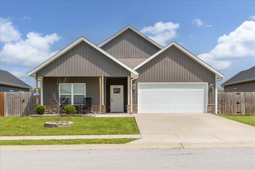 This incredible home in the heart of Gentry is close to schools, dining & everything NWA has to offer. Ranch-style with an inviting feel, featuring a welcoming covered front porch that’s the perfect place to relax. Inside offers an open floor plan with 9' ceilings, 3 bedrooms & 2 bathrooms, with LVP flooring throughout. The spacious open living room features a cozy propane fireplace & flows seamlessly into the kitchen with full wood cabinets, pantry, granite countertops, stainless steel farmhouse sink & a large island built for gathering. The utility room adds function with ample space & wood lockers for organization. The primary suite is spacious & flows into a well-appointed bathroom with tile surround shower, double vanity & a large walk-in closet. Enjoy spring & summer evenings in the private backyard complete with a covered patio & 6' privacy fence.