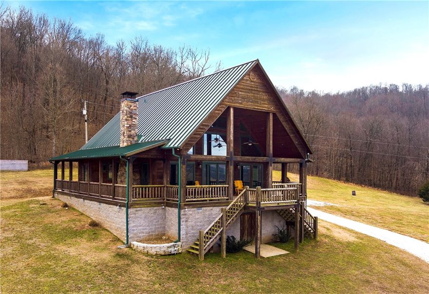 A wonderful opportunity to own 171 continuous acres in the Ozark Mountains only 30 minutes from the Fayetteville AR downtown square!  This stunning property boasts a creek with waterfalls and gorgeous blue swimming holes, meadows, mature trees & wildlife including deer, turkey, bear & more!  The main home was constructed in 2016 & trust me this is a must see!  2200 sf, 3 bed, 2 bath, 24' ceilings, 12" timber beam frame, blue pine ceilings, solid oak flooring, copper tub, Jenn-Air appliances, dry storage and shop beneath & more!  The original early 1900s cabin below was gutted & remodeled in 2010 (650 sf) and is a spectacular guest home w/ coziness and charm!  It features a wood burning fireplace in living area, wonderful decks for relaxing, a built in bed, kitchenette and full bath.  The trail systems on this property make for great walking, hunting or riding on an ATV, jeep or side by side!  30x60 pole barn for storing your equipment.  This property is a must see!  Private showings only for serious inquiries!