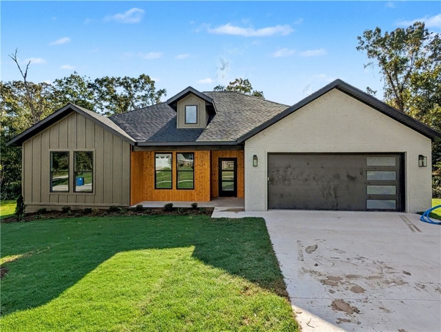 Welcome To Your Next Home! This Is The One You've Been Waiting For. Brand New Bella Vista Masterpiece Resting On A Massive Corner Lot. From The Moment You Pull Up, The Curb Appeal Is Simply Unmatched. The Open-Concept Living Area Is A Whole Vibe, With Seamless Flow Between The Living Room, Dining, And Kitchen. The Kitchen Is A True Showstopper Featuring Custom Cabinetry, Polished Quartz Countertops, A Top-Tier Appliance Package, And An Oversized Island. Find Your Zen In The Primary Suite, With A Soaking Tub, A Slay-Worthy Full Custom Tile Shower, Dual Vanities, A Private Water Closet, And Walk-In Closet In Primary Bath. This Home Is A Level Up With Its Stunning Wood Flooring, Custom Accent Walls, And Unique Ceiling Treatments. Covered Front Porch. Covered Back Patio Overlooking The Incredibly Rare Flat, Sodded Backyard. This Is Not Your Standard Spec Build. It's The One. And It Can Be All Yours In Less Than Thirty Days! **Deeded as 2 bed septic. Third room to be considered office/bonus or other non sleeping room.