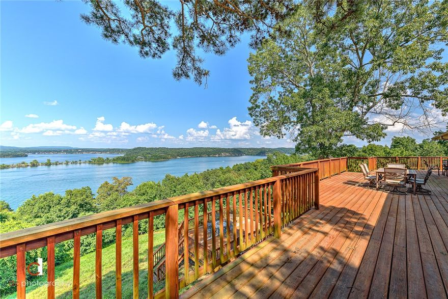 COMPLETELY REMODELED LIKE NEW LUXURY LAKEFRONT RETREAT WITH 180 DEGREE MILLION DOLLAR LAKE VIEWS!!  Located on a quiet cul-de-sac on a .84 acre waterfront lot, this 2 level dream home comes FULLY FURNISHED and spares no expense!  MAJOR remodel in 2006!  2 levels of sprawling deck space and large covered patio take in some of the best views of Beaver Lake you can find!  Main level hosts large living room w/ fireplace and an amazing wall of view capturing windows/glass doors, large master retreat, second bedroom w/ full bath, and chef’s kitchen with top of the line stainless appliances including gas range, double ovens, copper vent hood, pot filler, imported backsplash, ice machine and more!  Lower level walks out to huge covered patio and features theater room, large family room w/ fireplace, 2 additional bedrooms, laundry room and a full bath.  Wood flooring, plantation shutters, $175K worth of furniture, DaVinci roof, Mahogany garage door, and more!