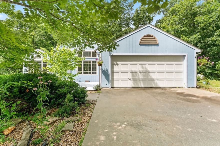Welcome to this delightful two-bedroom home featuring a versatile bonus room perfect for an office, hobby space, or guest area. Enjoy the warmth and character of the dedicated dining area and an inviting eat-in kitchen. Step outside to the covered back deck, semi-enclosed for added comfort and offering endless potential for relaxing or entertaining. The beautiful cottage garden creates a welcoming first impression, complemented by a wheelchair-accessible ramp to the front door. Nestled on a quiet cul-de-sac near Branchwood, with easy access to serene lakes and golf courses. This home offers a wonderful opportunity to add your personal touch and make it your own. The property is being sold as is with no repairs.