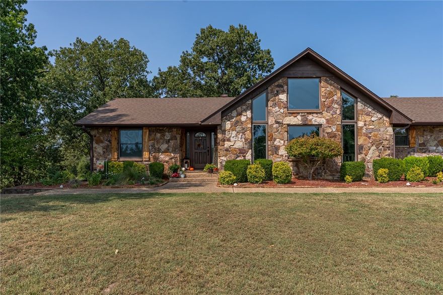 A 3300 square-foot beautifully updated home with two shops, a barn, a unfinished mother-in-law suite, 21 acres, a stocked pond, shooting range, and horse arena! What more could your heart possibly desire?! Plus its only 35 minutes from Fayetteville! This property is an absolute dream and you can tell it has been very well maintained and taken care of. Home has been remodeled from head to toe and boasts a great open layout with tall ceilings. You will have your own slice of heaven with the peace and quiet 21 acres and a beautiful pond can bring you. Fireplace in living room is a pellet fireplace. A value like this doesn't come along very often so don't miss your chance to live the American dream right here in Arkansas.