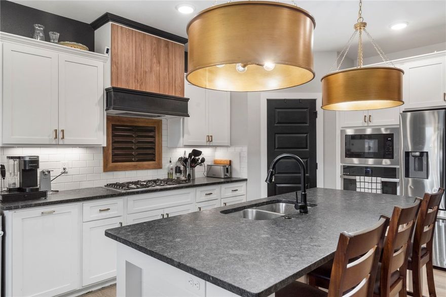 Seller is offering $1500 in buyer concessions!  Welcome to this inviting Pea Ridge home with a functional floor plan, three-car garage, and a backyard designed for gathering and relaxation. The entry opens to a flexible room that can serve as a home office or an additional bedroom. The main living area features abundant natural light, tasteful finishes, and a comfortable flow that makes the home both stylish and practical. Two bedrooms share a Jack & Jill bath, while the primary suite is privately located with its own spacious bathroom, including a soaking tub and separate shower. A half bath and laundry room are also conveniently located on the main level. Upstairs, a generous bonus room provides extra space for a bedroom, playroom, or media area. Outdoors, enjoy the covered patio, fire pit, and fully fenced yard—perfect for entertaining or unwinding at home.