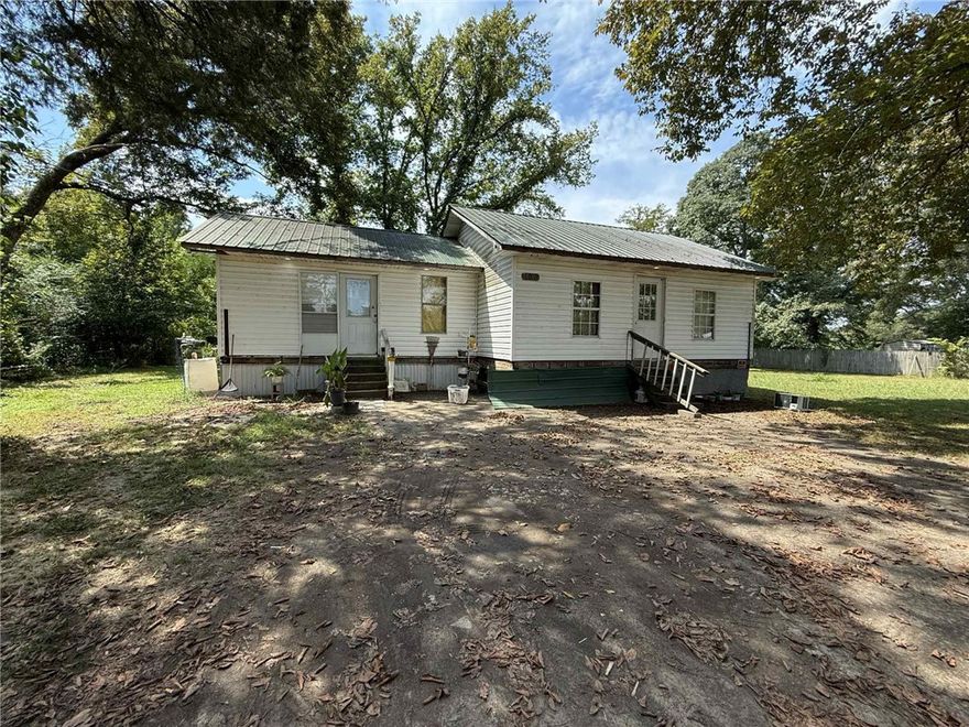 Situated on a generous 0.43-acre lot with public utilities, this 2-bedroom, 2-bath home is ready for your personal touch. With some TLC, it could be the perfect starter home, rental property, or investment opportunity. Enjoy the spacious yard for gardening, outdoor living, or future expansion. Bring your vision and make it your own!