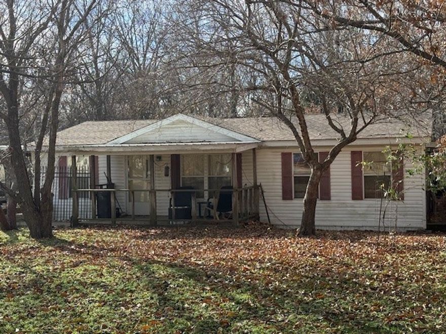 Come enjoy a peaceful setting just minutes away from area attractions. This 3/2 mobile home sits on a corner lot that is just over an acre and has plenty of shade trees. The back of the property is sloped into the wooded area. There are outbuildings that can be used or torn down. The covered porches give you quiet places to sit with your morning coffee. This property could be used as a primary residence or home away from home. There are nearby parks and a fire station. It has quick access to downtown Bentonville. A 12 mile drive will get you to the Walmart Museum or Crystal Bridges. A 10 mile drive and you can be at Lake Atlanta or to Pebble Beach on Beaver Lake. You'll want to see this property before it's gone! Schedule your showing today!