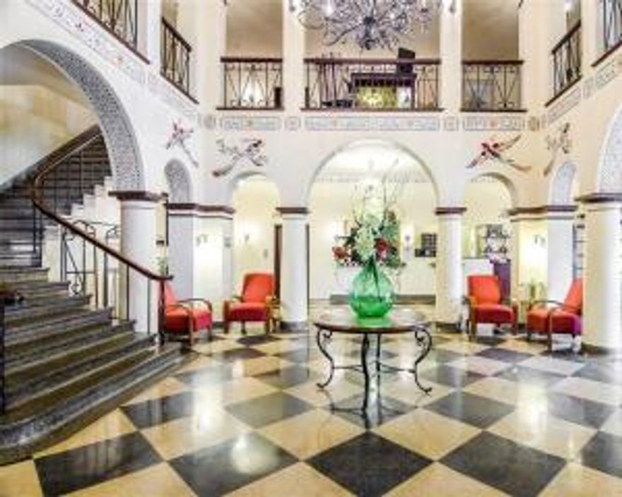 Trendy, yet historic boutique hotel featuring Spanish inspired archways and architecture. Includes interior corridor hotel with restaurant/ bar, covered parking garage, plus parking lot. Mail level lobby features stately staircase, elevator, and grand chandelier in soaring ceiling of 2nd floor mezzanine. Restaurant/Bar on main level with connecting covered terrazzo. 2nd and 3rd floors house a variety of upscale rooms and suites, laundry, and storage. Some rooms currently being updated. (Subject to Restaurant/Bar Lease). Financials subject to Seller approved proof of funds/pre-approval letter. Proposals subject to Seller's attorney approval (Option of Seller). Information subject to change. Sale subject to obtaining all necessary releases. No PD.