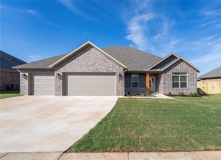 Beautiful new construction with a thoughtful open layout and designer finishes throughout. The spacious living area features a vaulted ceiling, large windows, and a cozy gas-log fireplace, creating an inviting space to gather. The kitchen boasts white cabinetry with soft-close doors and drawers, stainless appliances including a gas range, a large island with pendant lighting, and stunning granite countertops. The ownerās suite offers a relaxing retreat with a double-sink vanity, tiled shower, soaking tub, and large walk-in closet. Wood-look tile runs throughout the main living areas for easy maintenance and style. Extras include a mud bench, 3-car garage, fully sodded and fenced yard, gutters, and solar decking in the attic for energy efficiency. Conveniently located near parks, schools, and the University of Arkansas.