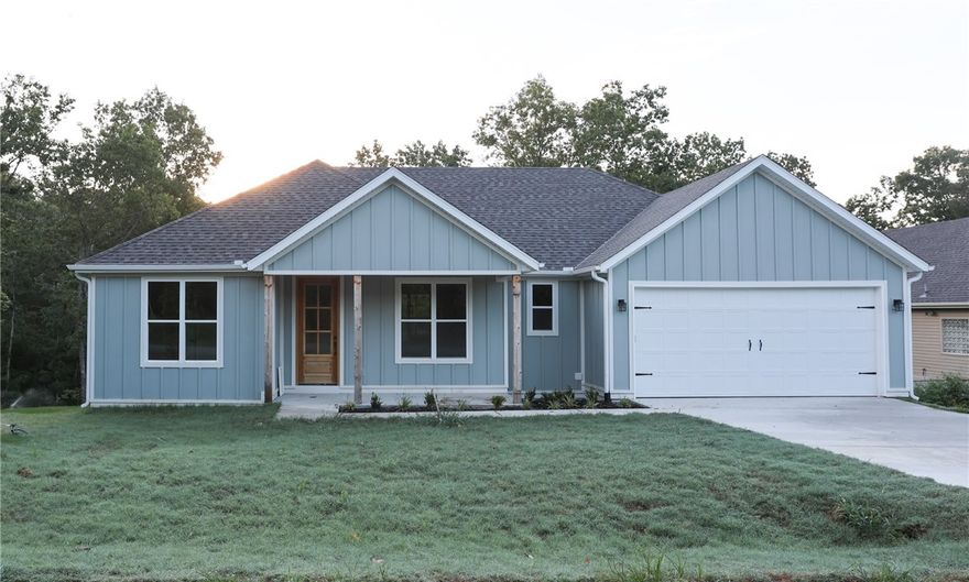 Experience lake-area living in this beautifully designed new construction home near Lake Loch Lomond and less than a mile from the Branchwood Rec Center. Enjoy peaceful views from the expansive covered back deck or relax in the thoughtfully crafted interior. This 3BR/2BA home features a luxurious owner’s suite, spacious laundry room, high-end quartz countertops, custom built-ins, and a nice garage with abundant storage. Built strong and smart by one of Bella Vista’s best builders. Bella Vista offers 9 golf courses, scenic lakes, over 100 miles of trails, and the state's first mountain biking chairlift (coming soon). Whether you're seeking adventure or tranquility, this home delivers both in a vibrant community surrounded by natural beauty. Don’t miss your chance to own a slice of the Bella Vista lifestyle—schedule your showing today!