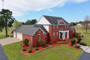 This prestigious 5,218 sqft brick home sits on 7 beautiful acres in a peaceful country setting, conveniently located about 5 minutes from town. The house has a split floor plan with 4 bedrooms and 4.5 bathrooms. There are a few multi-purpose rooms that could be used for additional bedrooms. The amount of closet space in this house will blow you away and the luxurious master bathroom and bedroom are sure to please! This home has it all, including a pool and large fenced patio area as well as a hidden safe room in the finished basement. It has been very well maintained and is immaculate from top to bottom. There is a spacious storage building and carport in addition to the 3 car garage which offers plenty of space and storage of its own. Call for your showing of this gorgeous property!
