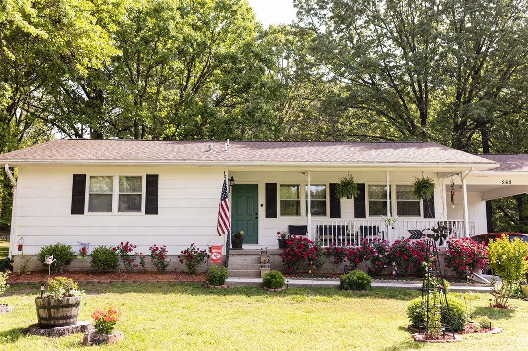 This charming 2-bedroom, 2-bath home sits on 2.04 acres along a quiet, low-traffic street north of town. Enjoy the beautifully landscaped yard while you relax on the covered front deck. The home has a detached storage building, as well as 2 storage rooms under the carport to provide ample space for your tools and toys. The property also features an eco-friendly rain collection system for those who wish to water the garden for free. All #s are approx, age & sq ft per assessor.