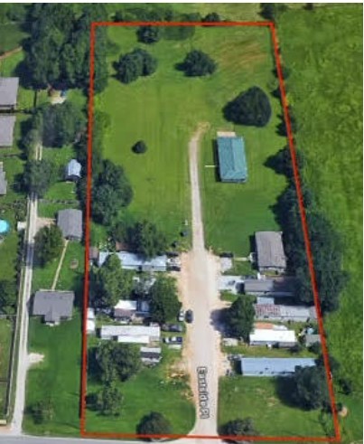 Excellent investment or redevelopment opportunity. Property has 10 mobile home lots and 1 rent house producing gross annual revenue of $60,480. Property is currently in County planning district. Sewer and water available at street would require City annexation.
