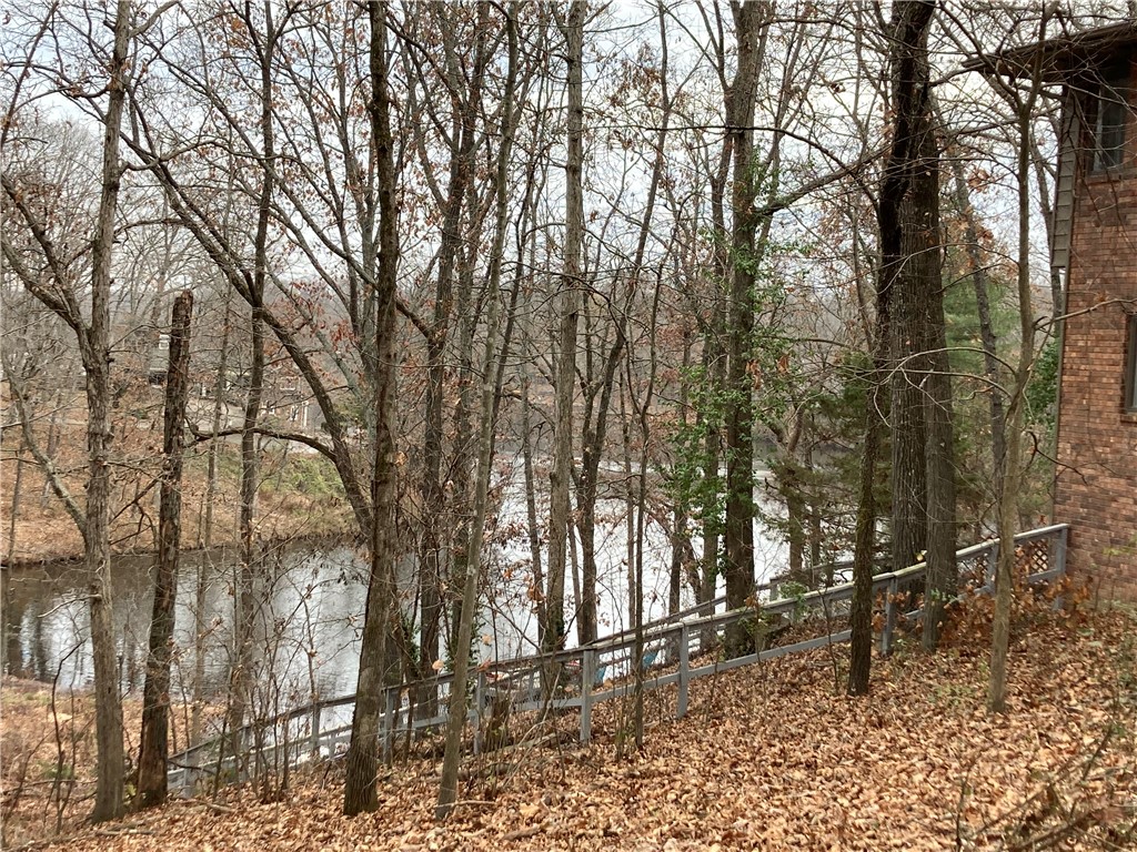 Great seasonal view of Lake Avondale cove waterway. Property has access to Lake Avondale Cove waterway just a few steps from rear property line (over common property). Your home site will be only a 5-minute walk to the Lake Avondale swim Beach, community dock and Bike trail access. Owner/Agent.