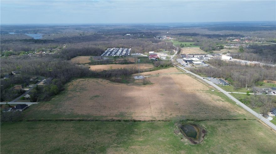 ATTENTION DEVELOPERS looking for high return of cap rate & equity: This fully approved, zoned, entitled and ready to build 185 slip RV Resort is RARE opportunity!  886’ frontage on hwy. 279 and connects directly to NWA’s national acclaimed and sprawling bike trails system in the Ozarks and NWA region 15 minutes from down down Bentonville.  Large Scale development plans includes 185 slips -140 RV slips and 45 glamping & tiny home sites for premium camping rental experiences. Itemized bid plans/costs/ P&L proformas with full construction drawings/Civil Engineering available for serious prospects. Plans include pickle ball courts, dog park, pool, office/community bldg. pond and water features to meet resort standards demand of market.  Conveniently located with access to Bentonville/Bella Vista and all of NWA. Close to golf courses, lakes, downtown Bentonville, Walmart HQ campus, (See documents icon for details) See drone video.