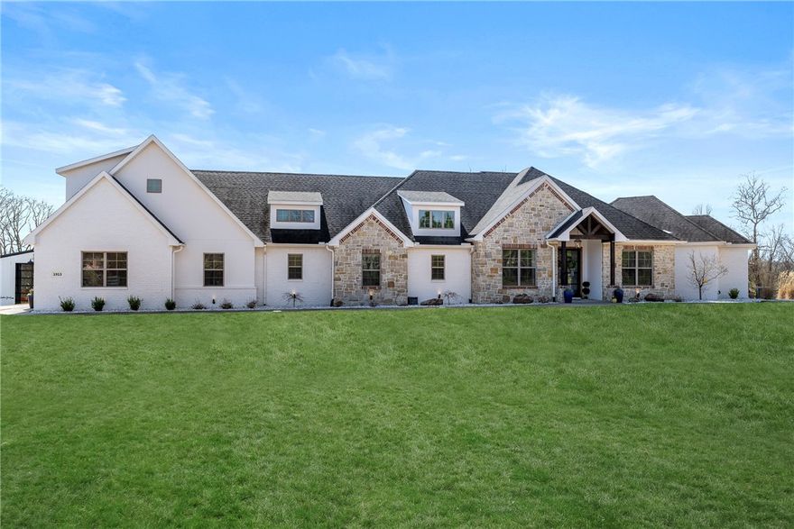 Experience refined country living in this exceptional 4400+ sq.ft. estate set on private 5 acre tract in prime location.  Recently refreshed interior & exterior paint, updated flooring & designer lighting, this impressive home offers elegance & comfort. A light-filled living area showcases a striking FP w/custom built-ins flowing seamlessly into the chef’s kitchen, featuring center island, sink, osmosis/charcoal filt sys, prep sink, pantry, dble ovens, M/W, & 6-burner gas cooktop. Primary suite offers a spa-inspired bath w/soaking tub & tiled shower.  A guest suite w/bath, +2 add’l bdrs, wics, Jack & Jill bath, are thoughtfully arranged on main level along w/a 2nd living area,½ bath, office, & safe room.  Upstairs bonus room for flexible space. Designed for entertainment, outdoor living space features stone FP, pizza oven, gas & wood grills, bar & patio seating; sparkling inground pool, 40x70 bldg. further enhances the property.  This remarkable property is just minutes from Pinnacle Hills.