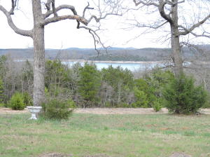 Beautiful view of Bull Shoals Lake from this 9 acres that includes an older 8 unit motel, a residence, a smaller, older 2nd home and outbuildings. The motel is no longer in business and needs updating. Some units are kitchenettes and have electric wall units and window a/c. The residence is a nice double-wide with add-ons.