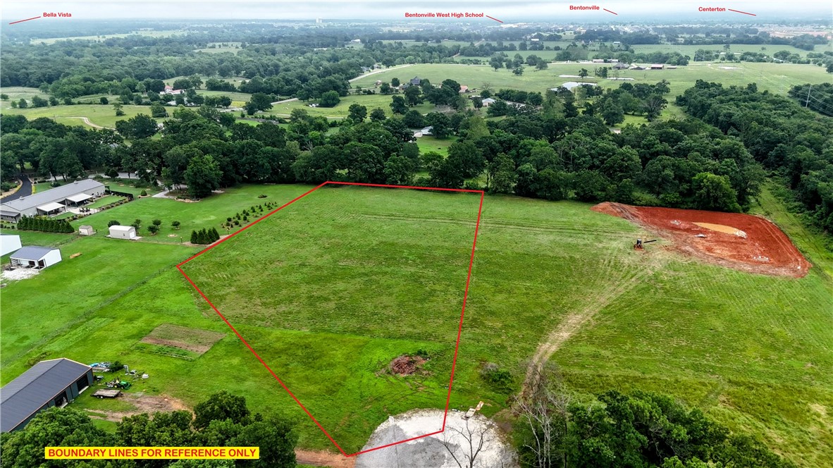 3.66-acre lot, ready for building your dream home! Mature trees line the back side & a section near the road for seclusion, yet the lot is open, and easy to begin construction quickly. This platted-out subdivision is close to I49 and Bentonville, Bella Vista, and Centerton areas-only 16 minutes to the Walmart Home Office, 9 minutes to Bentonville West High School, and 15 minutes to XNA. Bentonville Schools! This property is truly centrally located to anywhere in Benton County. Covenants include no mobiles. Electric and Centerton Water are available at the street, septic is required. Perc test available. Starlink Internet is available, too!