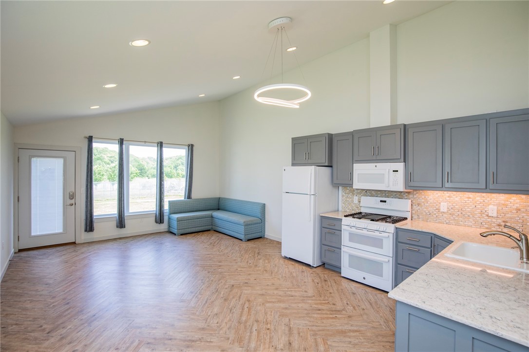 Awesome 1 bedroom 1 bath apartment with 1 car garage. Large open floor plan with lots of windows for natural light, vaulted ceiling and wood style flooring throughout . Kitchen features granite counters and all appliances. Bedroom has good closet space and built in drawers. Tankless water heater. large deck area for grilling. All Utilities and Lawn care are included.