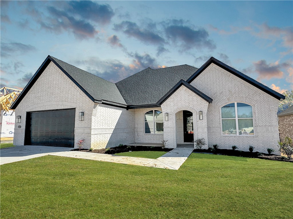 The picturesque Princeton 3 plan in Hughmount, located in Fayetteville, Arkansas! The Princeton 3 plan has 2209 Square feet with 3 bedrooms, 2 baths, and a flex space/study. These brand-new homes boast 4-sided brick. Upon entering, you will find a spacious living area featuring a gas fireplace with a poplar mantle. The kitchen will have 42-inch cabinets, lovely appliances and quartz countertops and tile backsplash. The Primary bedroom has a fabulous ensuite, dual sinks, with a walk-in shower with tiled walls and a soaking tub! LVP throughout! These homes feature LED lighting throughout, and a high efficiency AC with programmable Wi-Fi thermostat. Come find your dream home today! Taxes and Parcel TBD. Garage Door Opener!